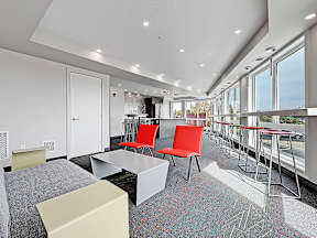 A conference room with a long table and chairs.