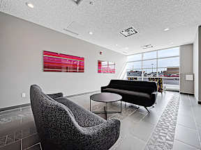 A modern waiting room with a view of the city.