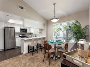 Kitchen with stainless steel appliances and dining area