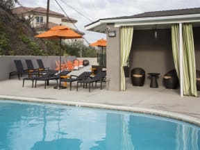 Apartments in Monterey Park, CA - Exterior View of Emerald Hills Swimming Pool With Lounge Chairs, Tents and Cabana