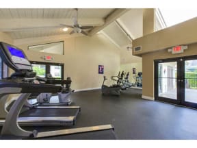 Fitness center with treadmills, stationary bicycles, ellipticals, and weight machines