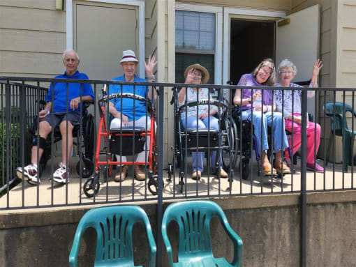 Residents gather on the patio to view the beautiful grounds of Aberdeen Heights Assisted Living