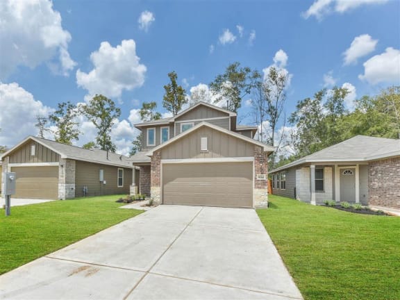 a house with a white garage door and a driveway