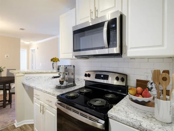 a kitchen with a stove and a microwave