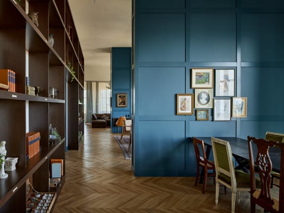 a room with blue walls and a wooden floor