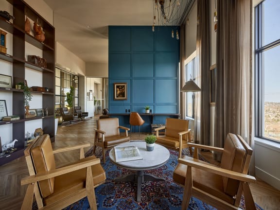 a living room filled with furniture and a large window