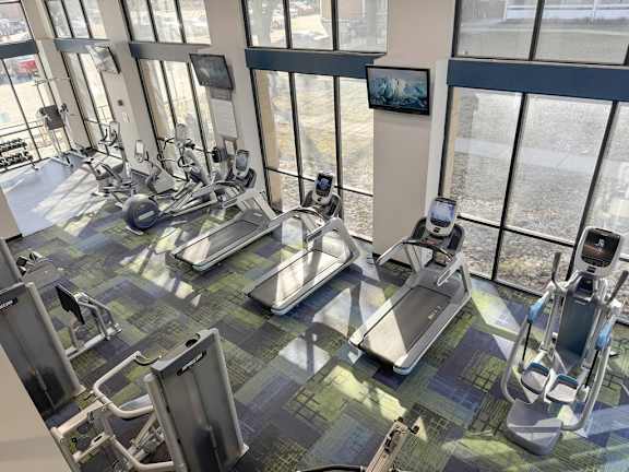 Fully equipped gym with ellipticals and treadmills
