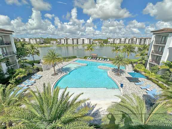  Heated pool with swim lane, cabanas, sun shelves and WiFi overlooking private lake