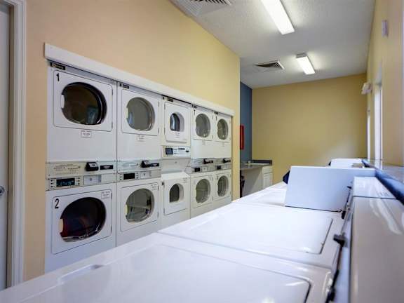 Clothing Care Center With Washer Dryer at Leigh Meadows Apartments, Jacksonville, Florida