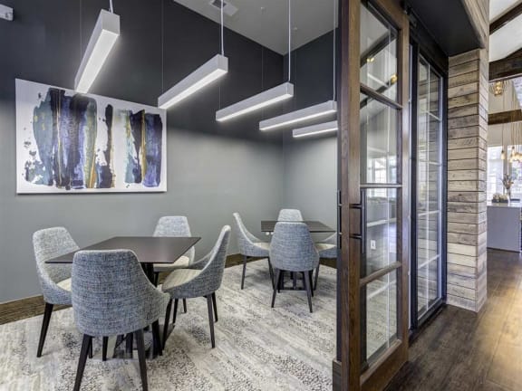 a conference room with a table and chairs