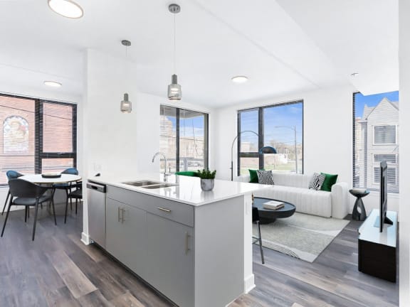 a living area with a kitchen and a dining table
