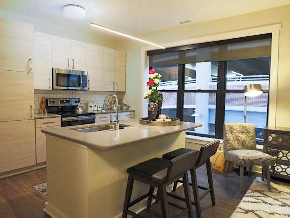 a living room and dining room with a couch and a table at 520 Lofts, Allentown, 18101