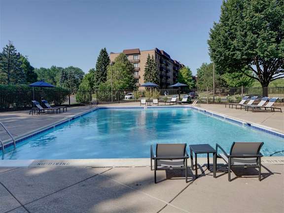 Outdoor pool with lounge chairs