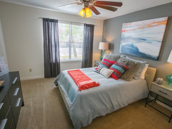 Bedroom With Expansive Windows at Saw Mill Village Apartments in Columbus 
