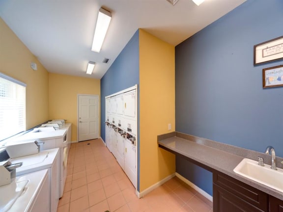 Clothing Care Center With Folding Station at Holly Cove Apartments, Orange Park, Florida