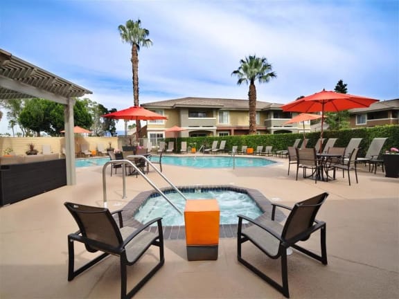 Lounge furniture on sundeck by pool at Mirabella Apartments, CA, 92203