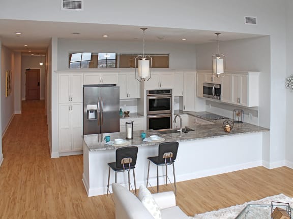 Light maple-colored hard surface flooring at Residences at Halle, Cleveland, 44113