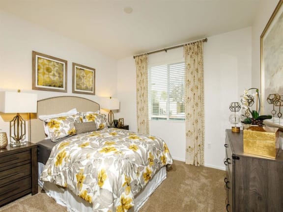 Master bedroom with a window on the left and can fit a queen bed with 2 nightstands and a dresser