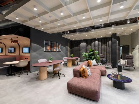 a room with couches and chairs and a table