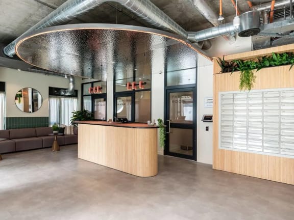 the lobby or reception area of a building with a reception desk