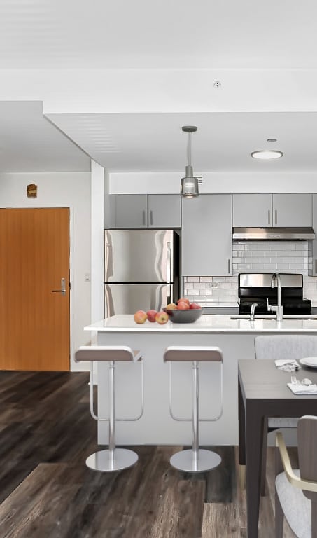 a kitchen and dining area in a 555 waverly unit