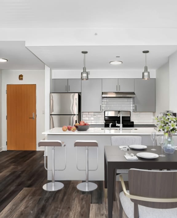 a kitchen and dining area in a 555 waverly unit