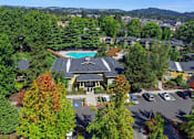 Thumbnail 7 of 37 - Aerial View of Clubhouse and Pool at Commons at Timber Creek, Portland, OR 97229