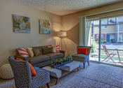 Thumbnail 27 of 37 - Living Room with Natural Light at Commons at Timber Creek, Oregon, 97229