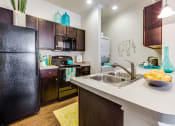 Thumbnail 2 of 27 - Modern Kitchen With Stainless Steel Appliances And Double Door Refrigerators at CLEAR Property Management , The Lookout at Comanche Hill, San Antonio