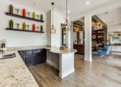 Thumbnail 16 of 27 - Upscale clubhouse with bar top seating at CLEAR Property Management , The Lookout at Comanche Hill, San Antonio, TX, 78247