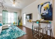 Thumbnail 6 of 27 - Wood-inspired plank flooring in living areas at CLEAR Property Management , The Lookout at Comanche Hill, San Antonio, TX