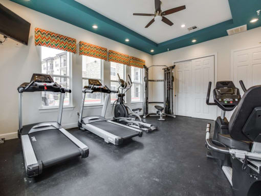 Fitness center with refreshing pool views at CLEAR Property Management , The Lookout at Comanche Hill, Texas
