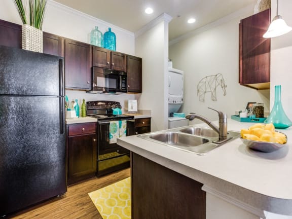 Modern Kitchen With Stainless Steel Appliances And Double Door Refrigerators at CLEAR Property Management , The Lookout at Comanche Hill, San Antonio