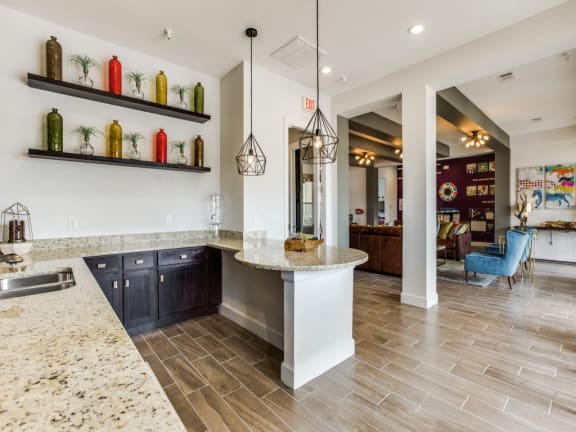 Upscale clubhouse with bar top seating at CLEAR Property Management , The Lookout at Comanche Hill, San Antonio, TX, 78247
