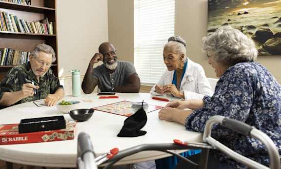 Group of people playing cards