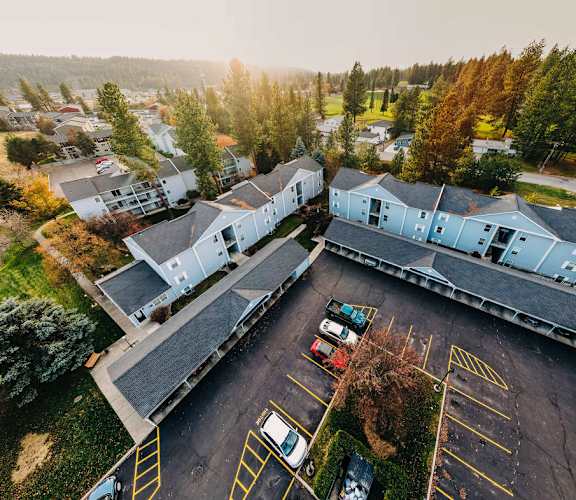an aerial view of a house and a parking lot