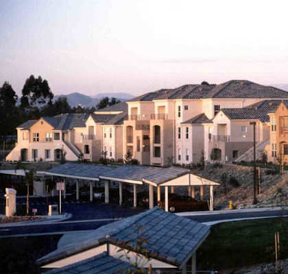 an aerial view of a row of houses on a street