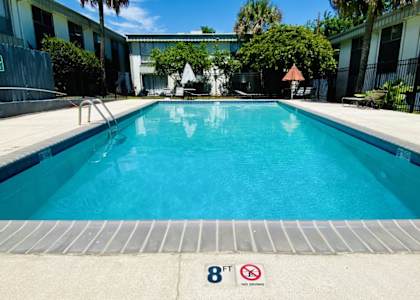 A pool with a height restriction sign of 8 feet.