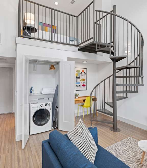 Living Area With Spiral Staircase at Placemakr Downtown Austin, Austin, TX 78701