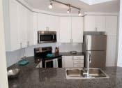 Thumbnail 7 of 24 - Updated Kitchen with Stainless Steel and White Cabinets