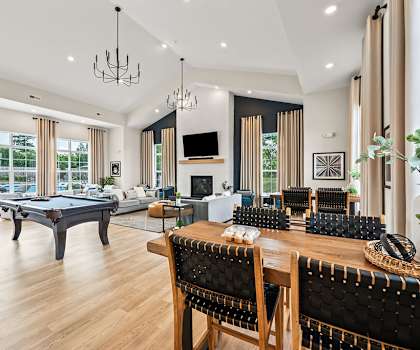 Clubhouse with seating area, pool table, and fireside lounge