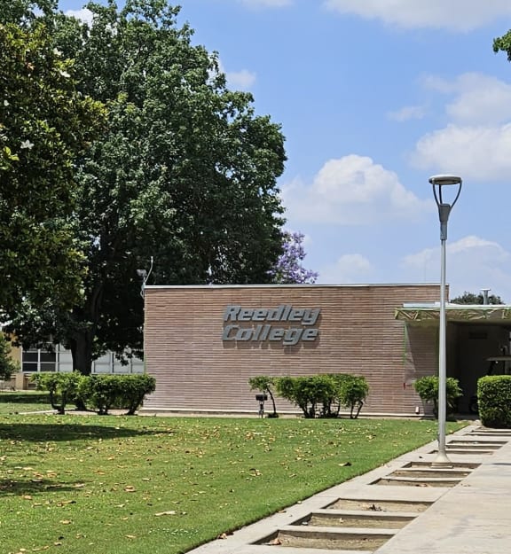 a brick building with a sign on the side of it