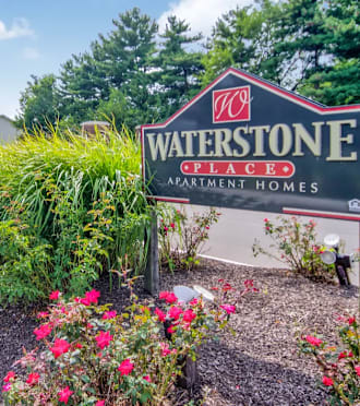 the sign at the entrance to bath farms with flowers