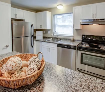 a kitchen with stainless steel appliances and granite counter tops  at Greenfield Village Apartments, Rocky Hill, CT