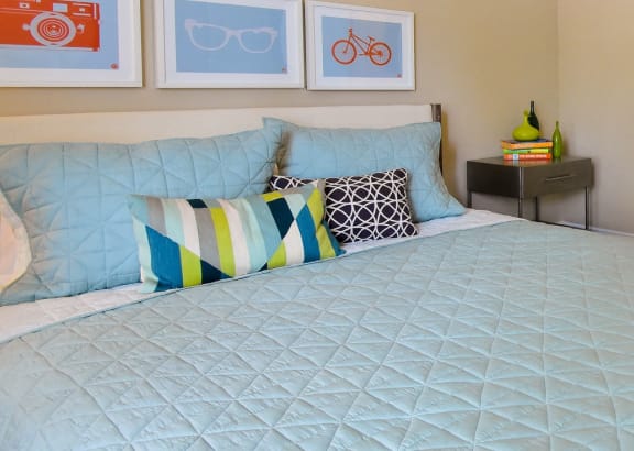 a bedroom with a large bed and a bathroom at Riverset Apartments, Memphis, 38103