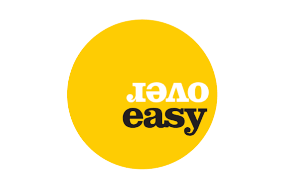 A black and white logo for Over Easy at The Residences at The Gilmore in Gilbert, AZ