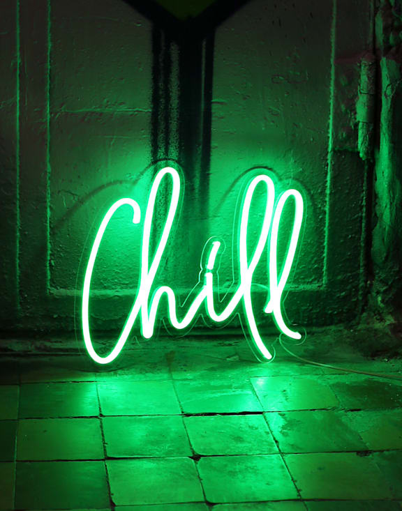 A neon sign that says Chill