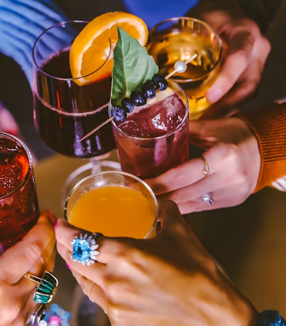 A group of friends are enjoying a drink together.
