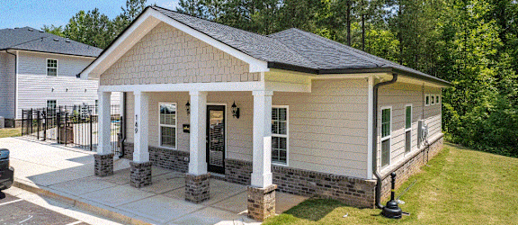 a house with a porch and a carport
