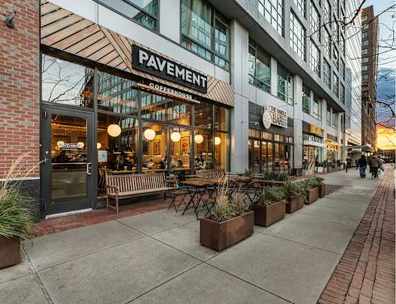 A storefront with the name "PAVEMENT" is visible.
